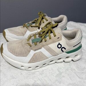 On Running Cream and White Athletic Shoes